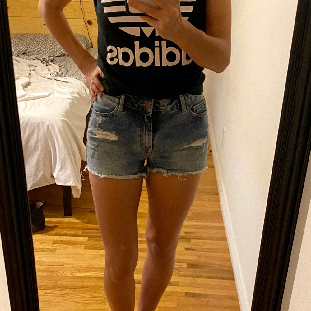 Distressed denim cutoff shorts